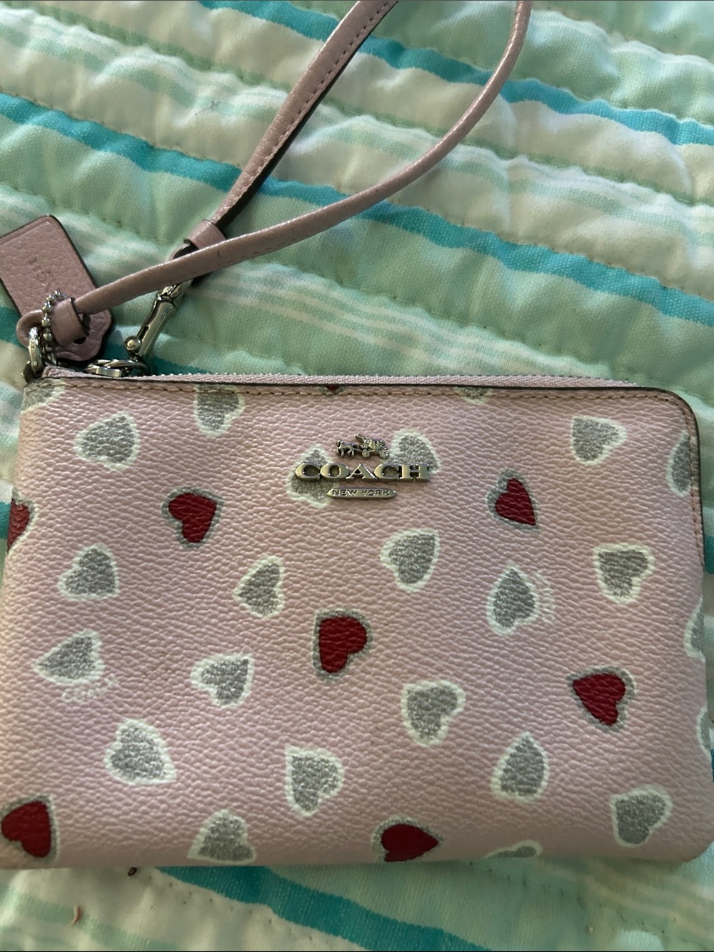 Coach Pink Leather Heart Wristlet with Red & Silver Hearts.  Two small marks